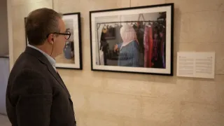 Man looking at images on display at Jordan's International Day of the Disappeared conference held in Amman.