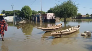 Residents using a canoe to go from one place to another