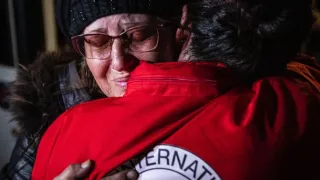 Two women hugging each other