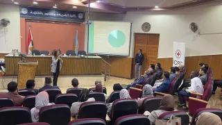 People gathering in a conference room 