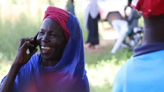 A Sudanese women uses the ICRC`s RFL service to reconnect with her family