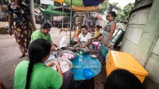 Sagaing, Myanmar, women cooking together in community kitchen 