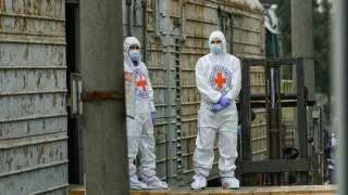 Two ICRC delegates in protective clothing