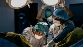 Doctors in surgery in an operating room.