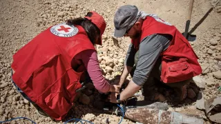 Note: The items in this picture were assessed as safe to be moved by ICRC staff who are qualified and experienced specialists conducting explosive ordnance disposal under strict safety rules. The ICRC strongly discourages all persons not qualified in explosive ordnance disposal from attempting any form of touching, moving or removing (demining) of explosive ordnance themselves.