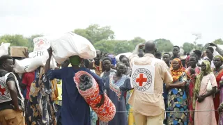 ICRC staff supplying essential items to refugees.