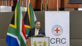 Alvin Botes speaking at the Global High-Level Initiative event on IHL in Pretoria