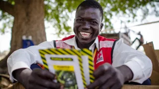 South Sudan Red Cross volunteer A South Sudan Red Cross volunteer shows seeds given out to women farmers in rural South Sudan to improve agriculture and food production in the onset of the rainy season.