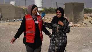 ICRC staff member with one of the beneficiaries 