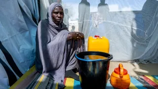 Hawa Adam Abdallah Charfadine, 35 (centre), collected water from a borehole installed by the ICRC near the Tiné transit site, Wadi Fira, Chad.