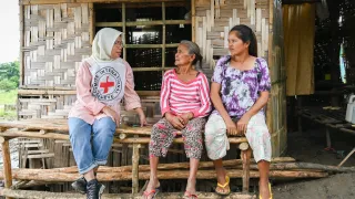 ICRC protection field officer Raidah Latip talks with conflict-affected people in Maguindanao del Sur