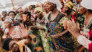 A church service underway in the Busuma camp.