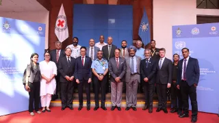 Dignatories, facilitators and organizers pose for a group photo