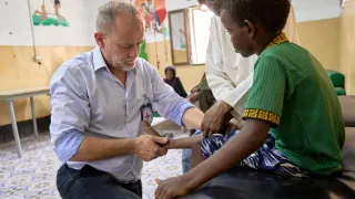 PRP manager Philip Morgan with a patient in Somalia