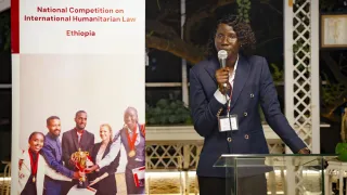 Nyamal making a speech at IHL Networking event organized by ICRC
