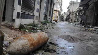 An explosive weapon lying in an empty street. 