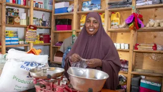 Photo of beneficiary in her ICRC supported shop