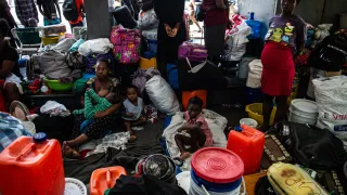 People who fled their homes in the Carrefour Feuille neighborhood because of recent attacks by armed gangs took refuge in a gas station, in Port-au-Prince, Haiti, on March 19, 2025.
