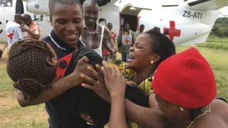 South-Kivu, North-East Shabunda, Tchonka airfield. A girl is reunited with her parents by the ICRC, after 6 years of separation.