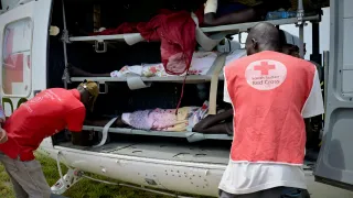 South Sudan Red Cross Society volunteers assisting patients before they are evacuated to Juba