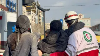 IRCS Rescue and Relief staff help an injured person in Tehran