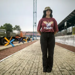 Olena Masliuk stands at the train station