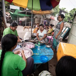 Sagaing, Myanmar, women cooking together in community kitchen 