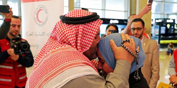 A%20Syrian%20refugee%20takes%20his%20missing%20daughter%20in%20his%20arms%20and%20kisses%20her%20on%20the%20forehead