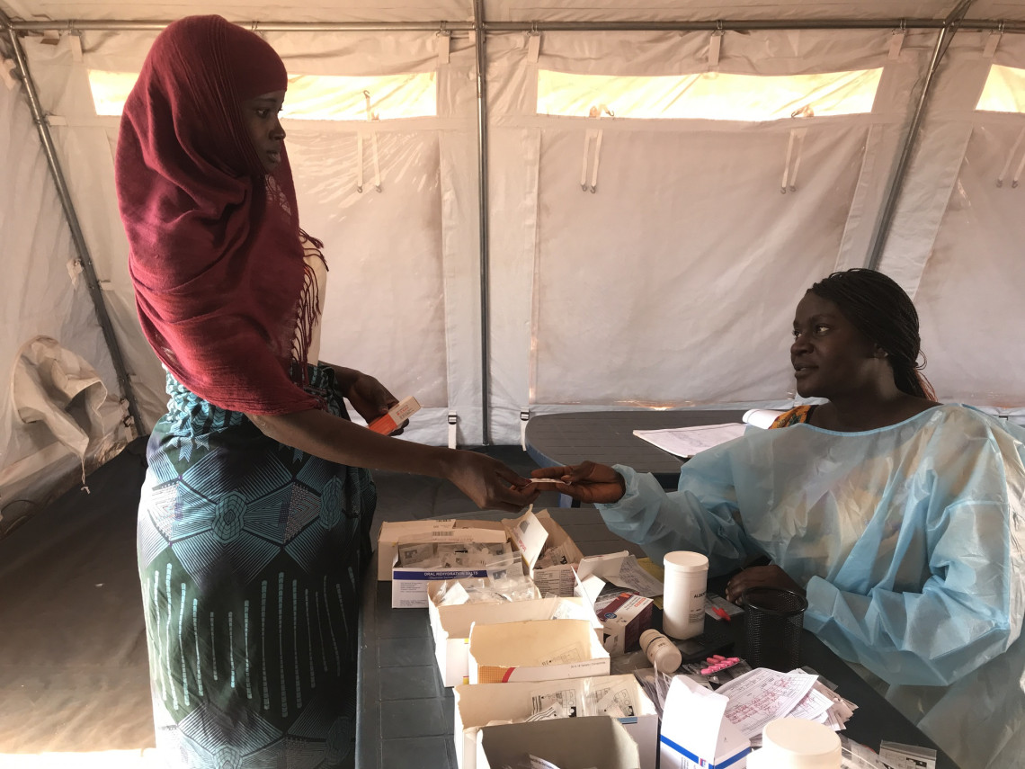 Tania Bacar receiving medication at the mobile clinic in Mozambique