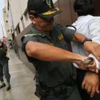 In Lima, Peru, a training exercise on the use of force and human rights includes a simulation of a suspect's street arrest.
