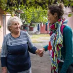 A nurse assists an elderly woman in the Kherson region of Ukraine.
