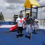 At an ICRC rehabilitation center in Guanajato, Mexico, a volunteer from the Mexican Red Cross assists two beneficiaries.