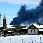 Oil refinery on fire in the outskirts of Grosny (Russia) as result of bombing raid.