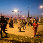 Slovenian Red Cross members with refugees and migrants in transit.