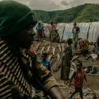 Congolese army units drive past displacement camps. 08 April, Sake, North Kivu Province, Democratic Republic of Congo. Sake was a key objective of an M23 offensive seeking to isolate the city of Goma. 