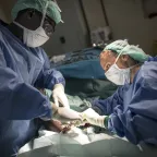 Akobo, county hospital. An ICRC surgeon operates a patient who was shot in the leg.