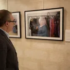 Man looking at images on display at Jordan's International Day of the Disappeared conference held in Amman.