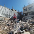 ICRC staff assessing a collapsed building