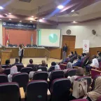 People gathering in a conference room 