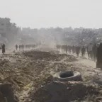 People walking along a dusty road