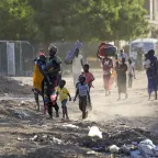 People flee their neighbourhoods amid clashes between the Rapid Support Forces and the Sudanese Armed Forces in Khartoum on April 19, 2023, following the collapse of a 24-hour truce