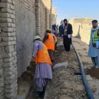 Construction workers in Kandahar City’s District 7 are working on a water supply project
