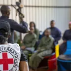 Law Students from a Kenyan University listen to an firearms instructer during an IHL War simulation in Nairobi, Kenya