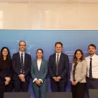 A group photo of eight representatives from the ICRC and Luxembourg MFA.