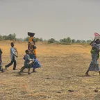 A displaced family gleaning rice in Usur village