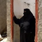 Arwaa stands in the doorway