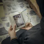 Hala from Anbar, holding the picture of her missing loved one.