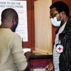 Red Cross delegate with a beneficiary