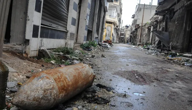 An explosive weapon lying in an empty street. 