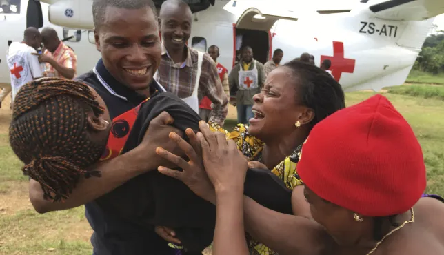 South-Kivu, North-East Shabunda, Tchonka airfield. A girl is reunited with her parents by the ICRC, after 6 years of separation.